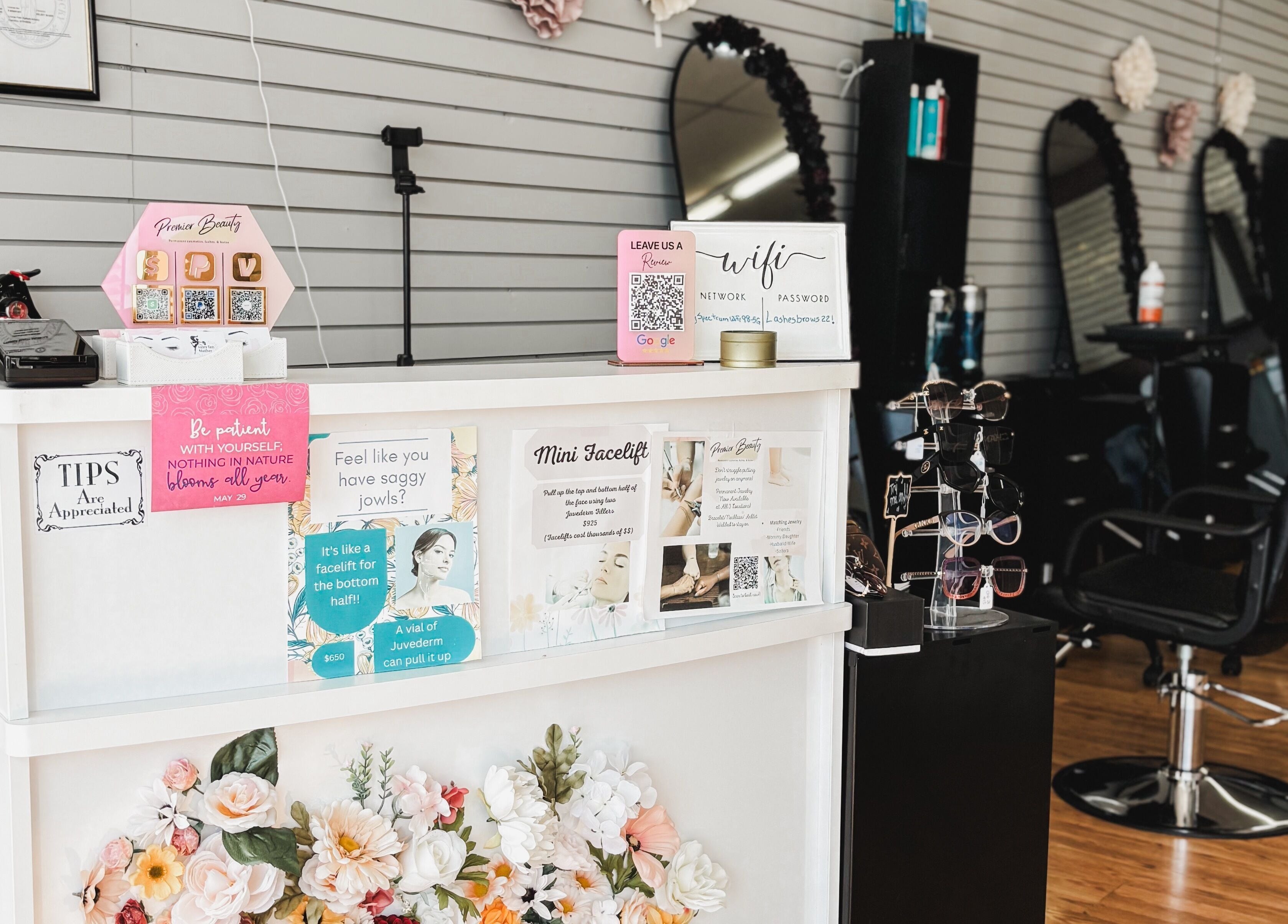 Reception area at Premier Beauty in Berea, Kentucky, US, showcasing elegant decor and seating arrangements.