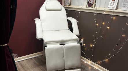 Relaxing treatment chair at Premier Beauty E - Town in Elizabethtown, Kentucky, US, inviting ambiance with elegant decor.