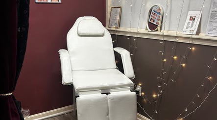 Luxurious white chair at Premier Beauty E - Town, Elizabethtown, Kentucky, US, setting a tranquil spa vibe.