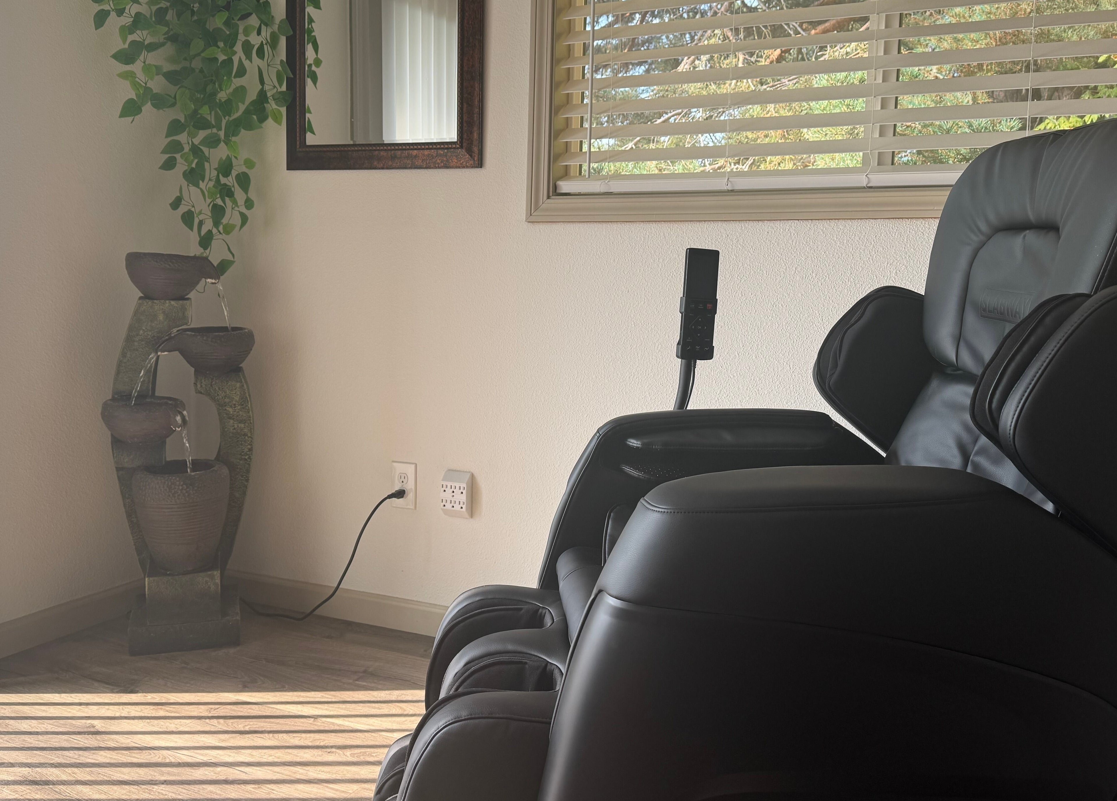 Comfy massage chair beside Zen fountain at Skinfluential LLC, West Linn, Oregon, US.