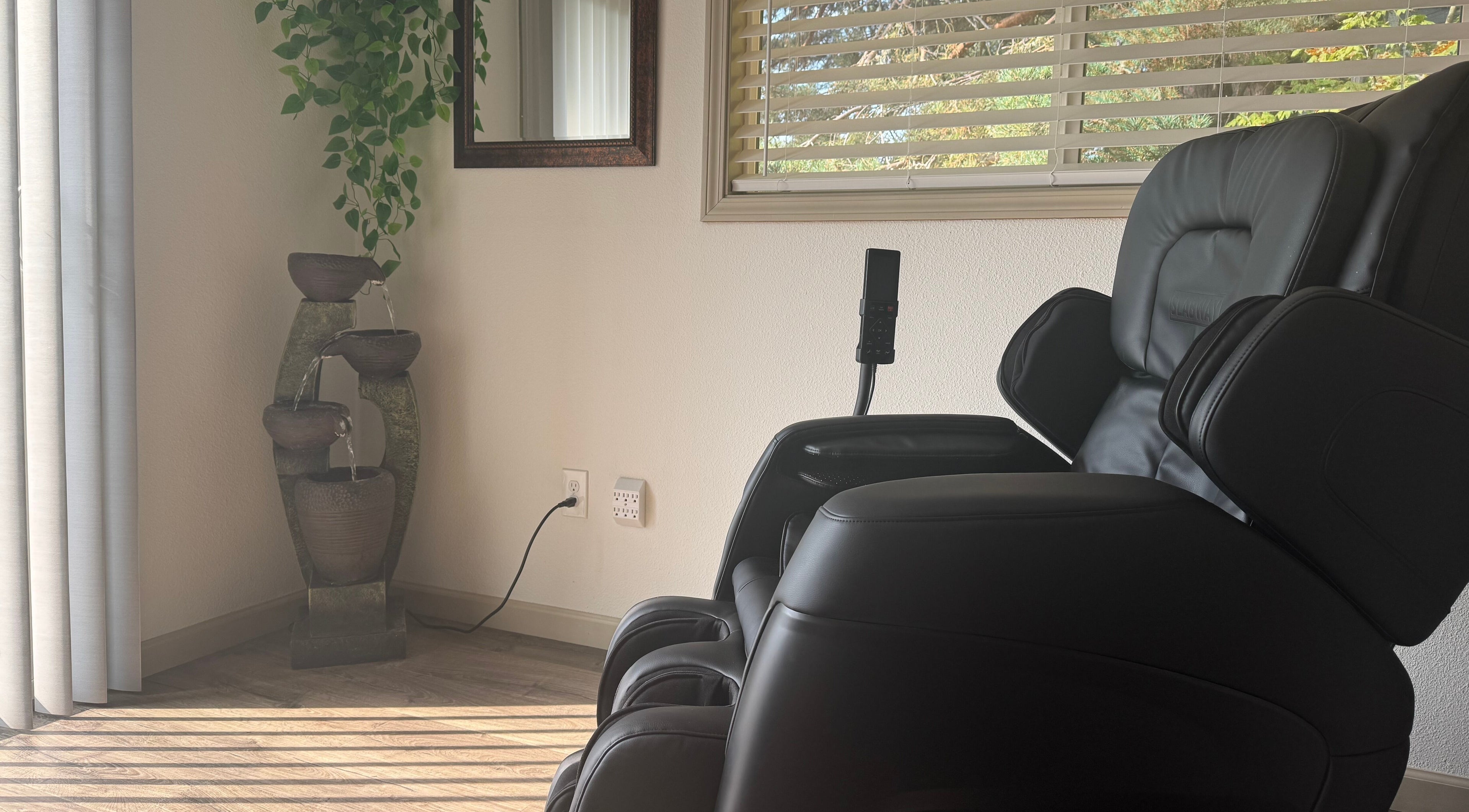 Comfy massage chair beside Zen fountain at Skinfluential LLC, West Linn, Oregon, US.