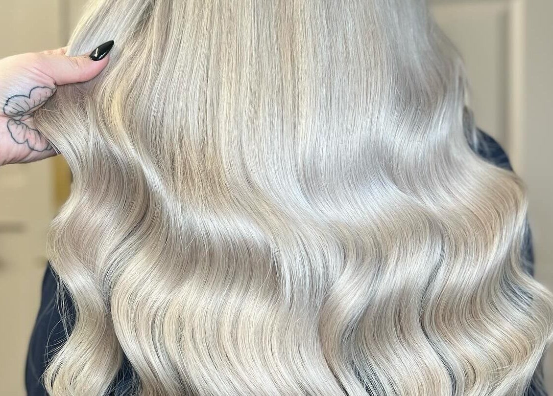 Luxurious blonde hair extensions styled at Loxy Locks Hair Extensions, Belper, England, GB.