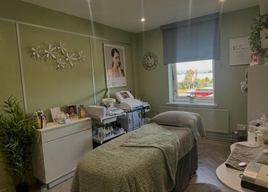 Calming treatment room at Timeless Beauty by Liz Foran in Paisley, Scotland, GB, featuring cozy ambiance.