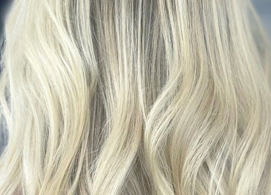 Blonde hair waves styled at Kerry Miller Hair, Cove Bay, Scotland, GB, showcasing elegant beachy texture.