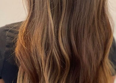 Long wavy brown hair styled at Kerry Miller Hair, Cove Bay, Scotland, GB.
