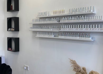 Nail polish display at Bare Beauty, Bournemouth, England, GB offering a chic and modern ambiance.