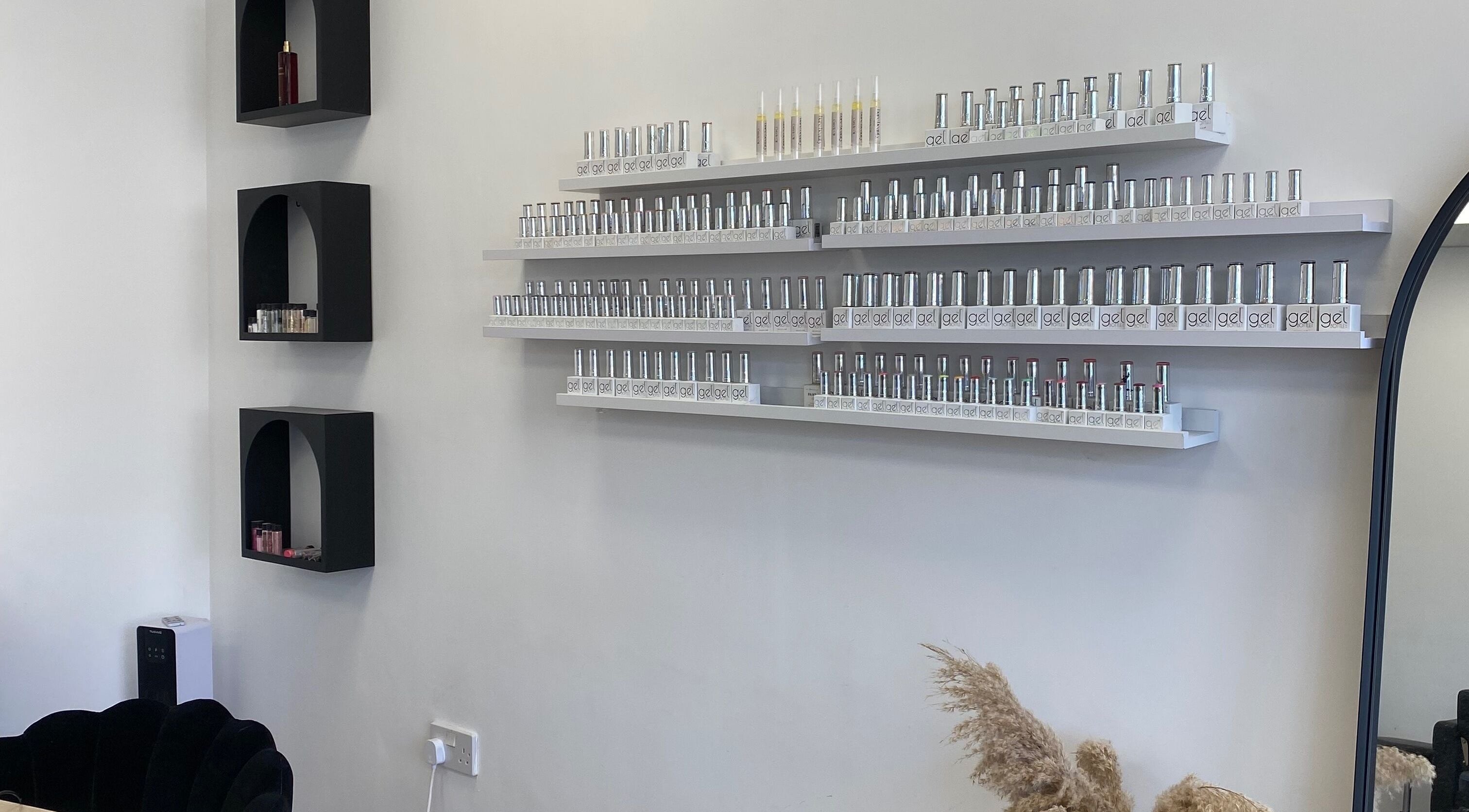 Nail polish display at Bare Beauty, Bournemouth, England, GB offering a chic and modern ambiance.