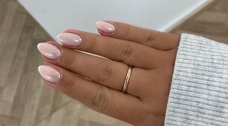Elegant pastel manicure at Bare Beauty, Bournemouth, England, GB showcasing glossy, rounded nails.