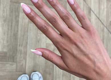 Manicured hand with modern pink and white design at Bare Beauty, Bournemouth, England, GB.