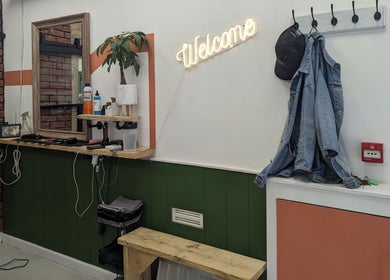 Cozy salon interior with a 'Welcome' sign at dooo Hub - Old Market (Gender Free) in Bristol, England, GB.