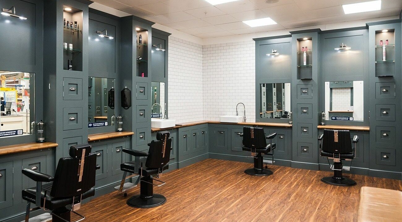 Modern barber space at Gould Barbers King's Lynn in Gaywood, England with sleek chairs and stylish design.