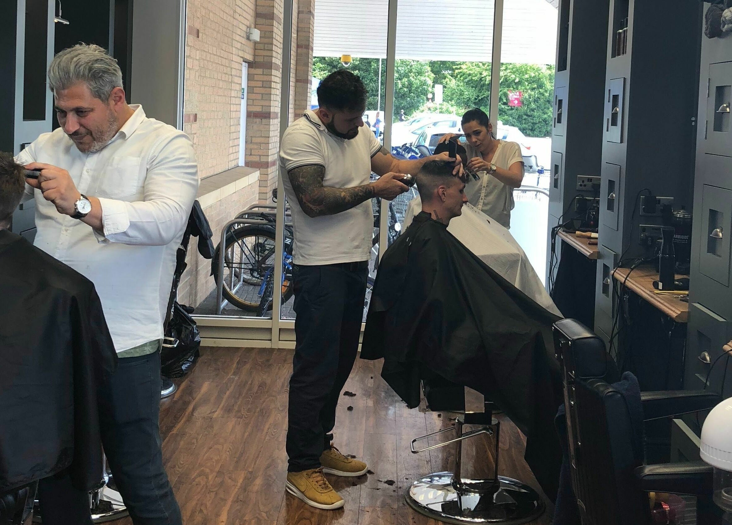 Stylists at Gould Barbers Huntingdon delivering professional haircuts in Huntingdon, England, GB.