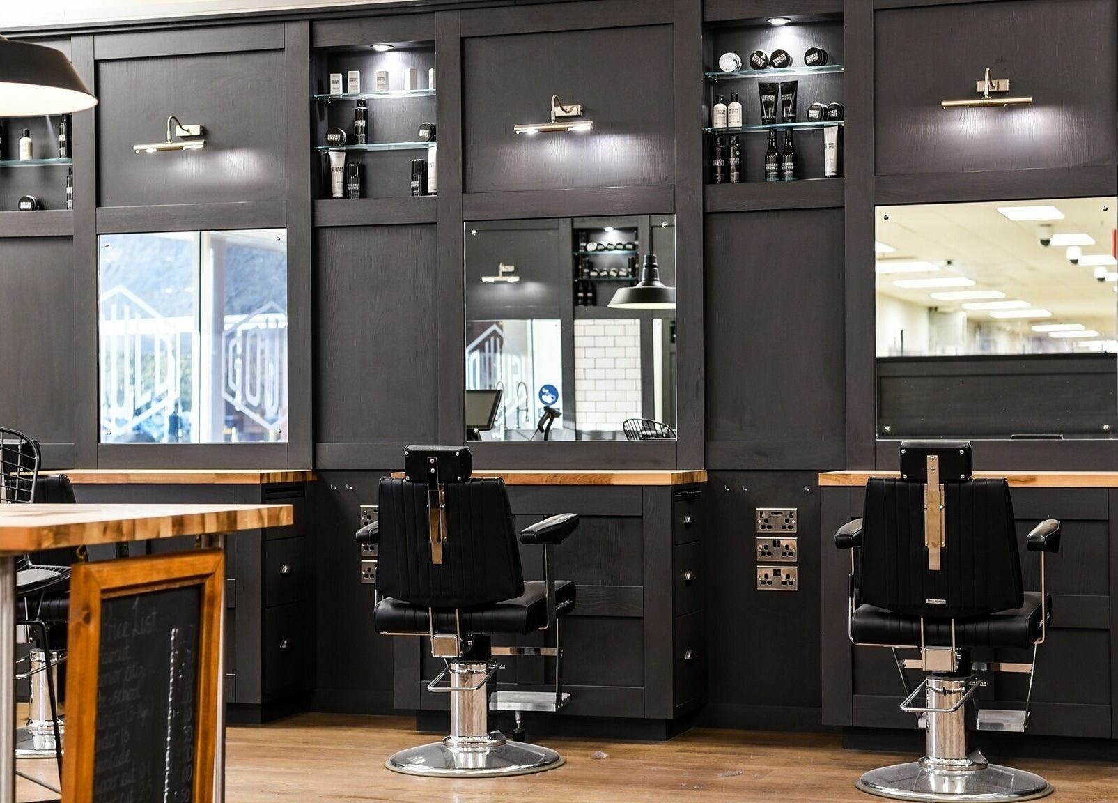 Modern styling stations at Gould Barbers Mansfield, Mansfield, England, GB, featuring sleek design and professional setup.