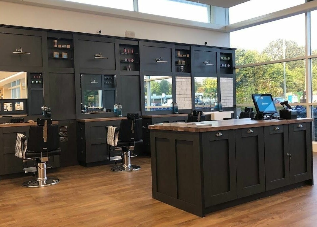 Interior of Gould Barbers Mansfield showcasing sleek design in Mansfield, England, GB with modern barber stations.
