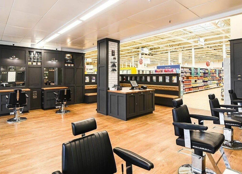 Interior of Gould Barbers Basildon (Pitsea) showing stylish barber chairs and sleek decor in Basildon, England, GB.