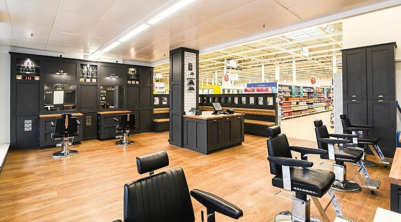 Interior of Gould Barbers Basildon (Pitsea) showing stylish barber chairs and sleek decor in Basildon, England, GB.