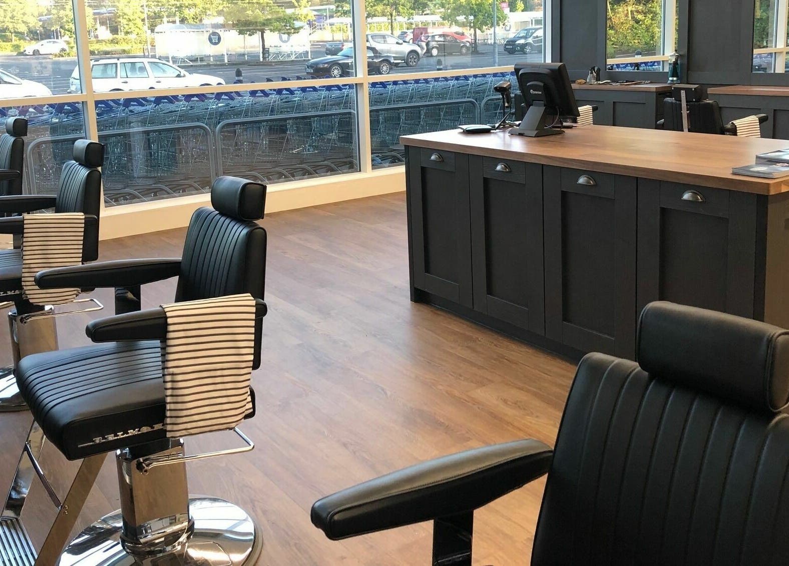Modern barber chairs at Gould Barbers Basildon (Pitsea) in Basildon, England, GB, offering stylish grooming services.