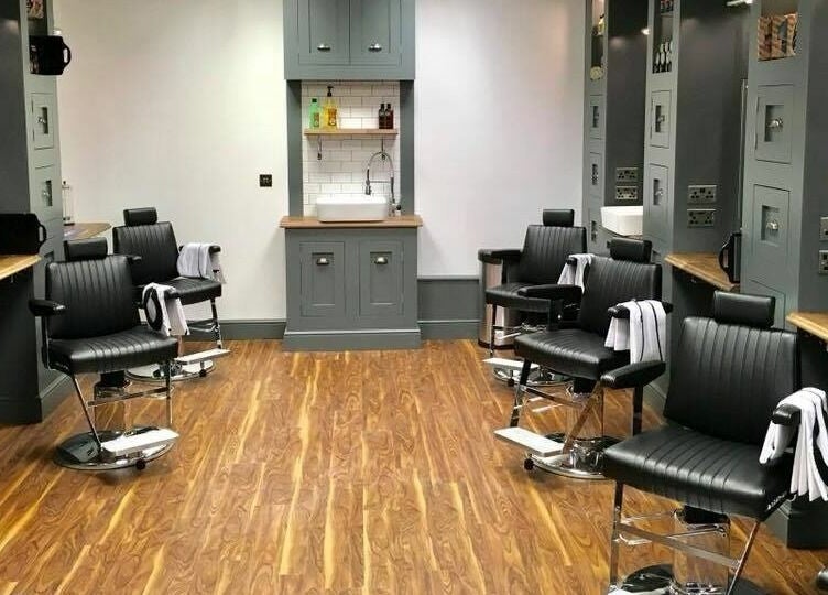 Sleek barber chairs and stylish decor at Gould Barbers Cambridge (Bar Hill), Bar Hill, England, GB.