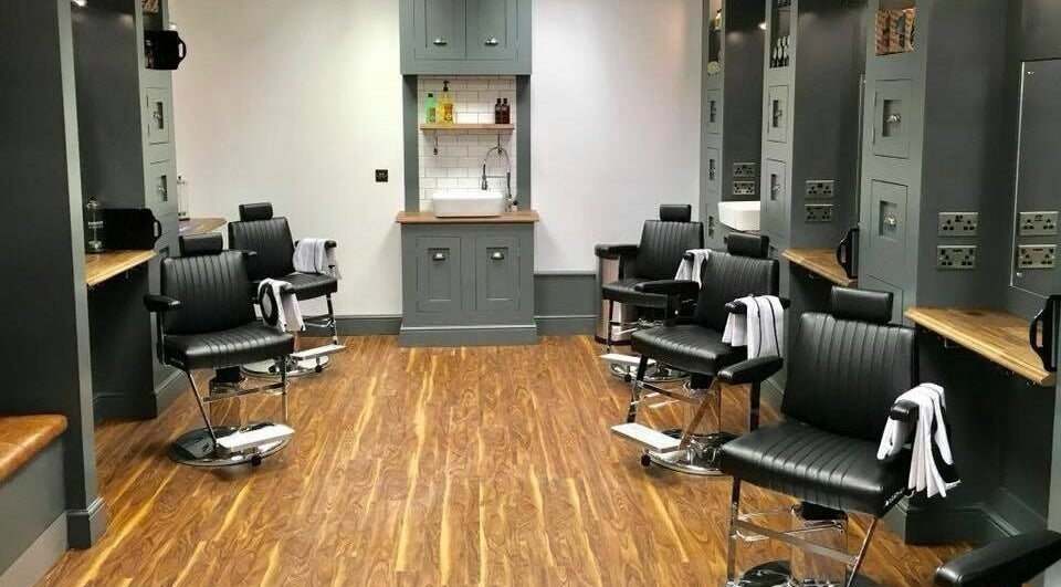 Sleek barber chairs and stylish decor at Gould Barbers Cambridge (Bar Hill), Bar Hill, England, GB.