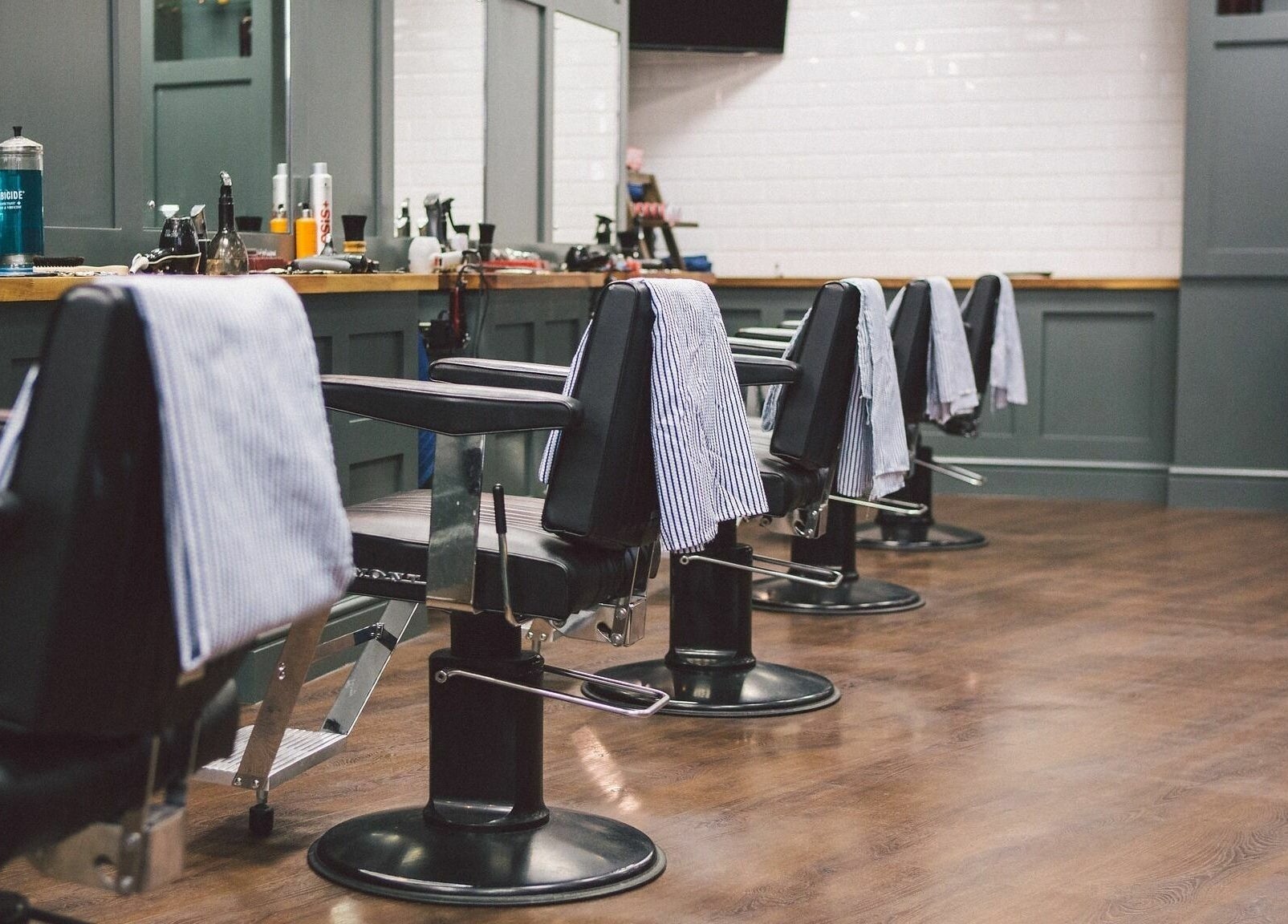 Elegant barber chairs at Gould Barbers Cambridge (Bar Hill), Bar Hill, England, GB, ready for a pampering session.