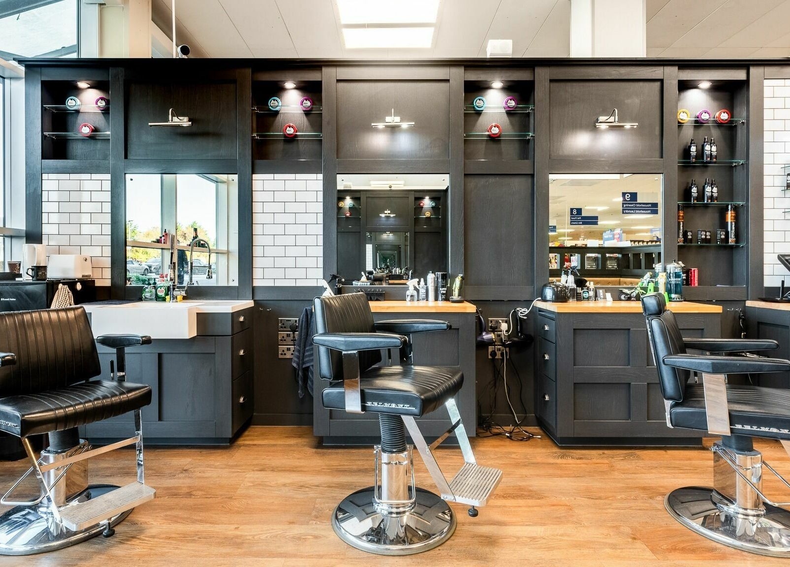 Modern barber chairs in Gould Barbers Newbury, Newbury, England, GB with sleek design and inviting ambiance.