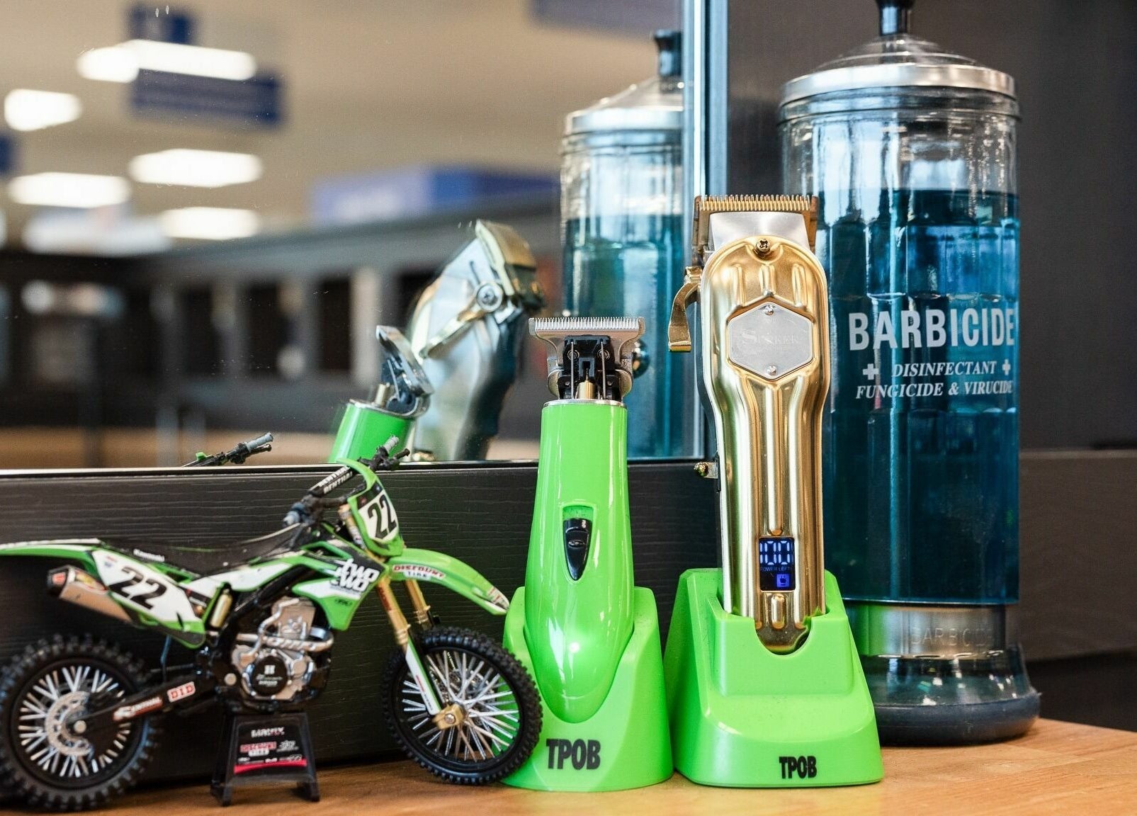 Barber clippers and bike model on counter at Gould Barbers Newbury, Newbury, England, GB.