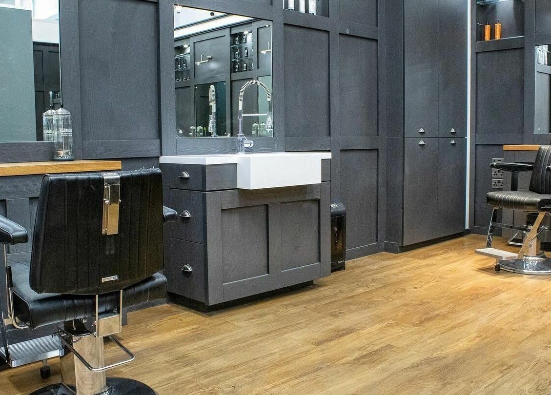 Modern barber chair setup at Gould Barbers Horsham, Horsham, England, GB showcasing sleek design.