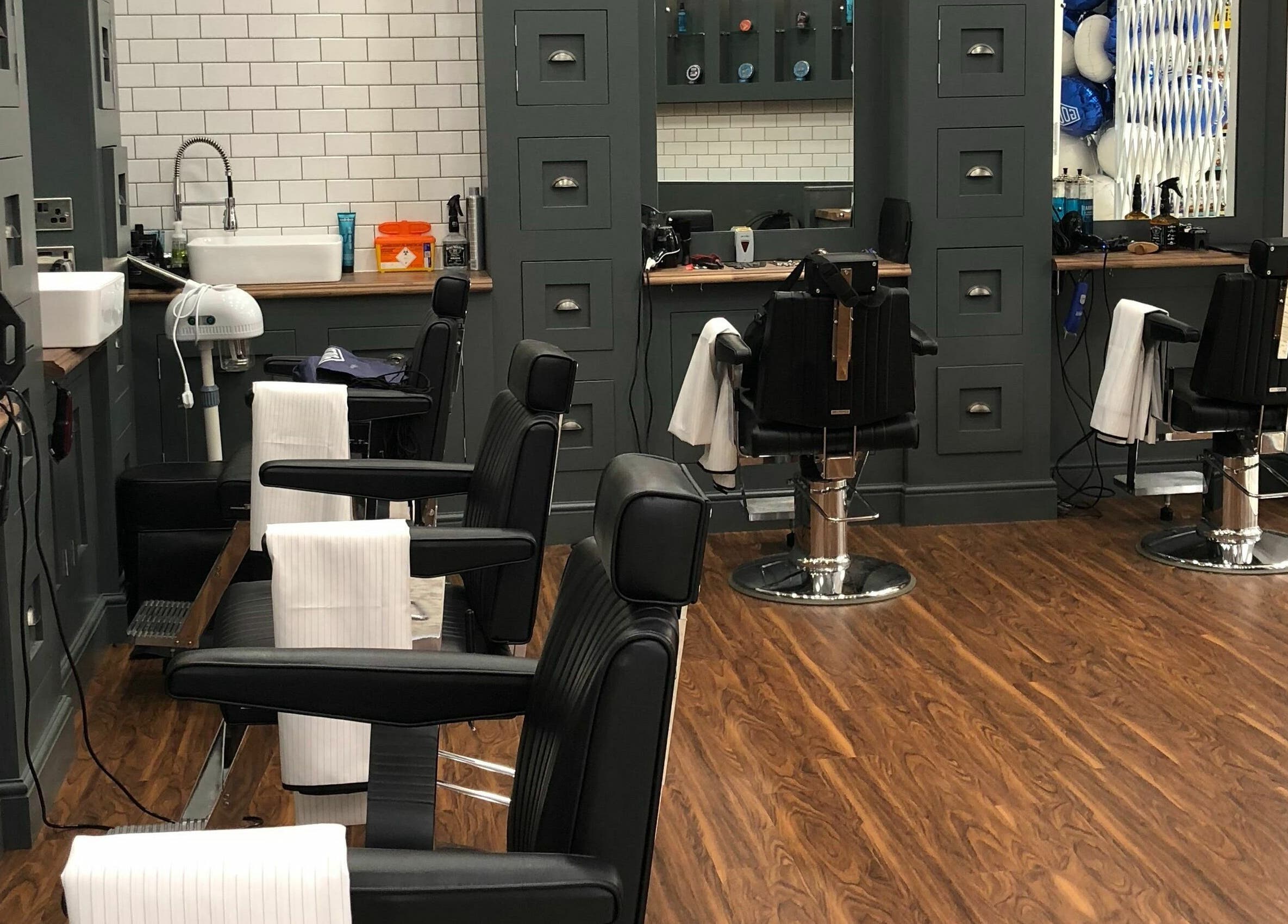 Interior of Gould Barbers Basildon (Mayflower), showcasing sleek barber chairs in Basildon, England, GB.
