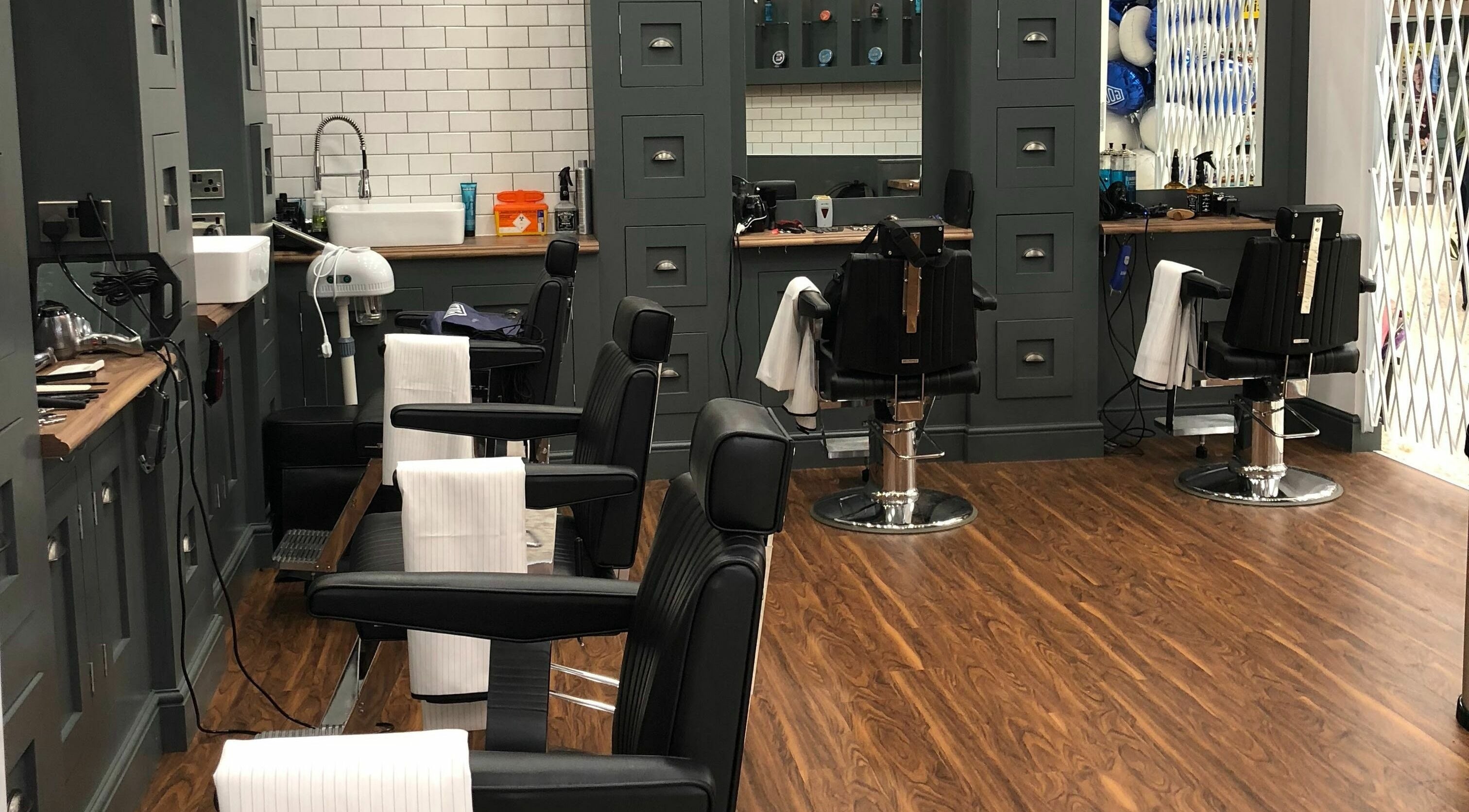 Interior of Gould Barbers Basildon (Mayflower), showcasing sleek barber chairs in Basildon, England, GB.