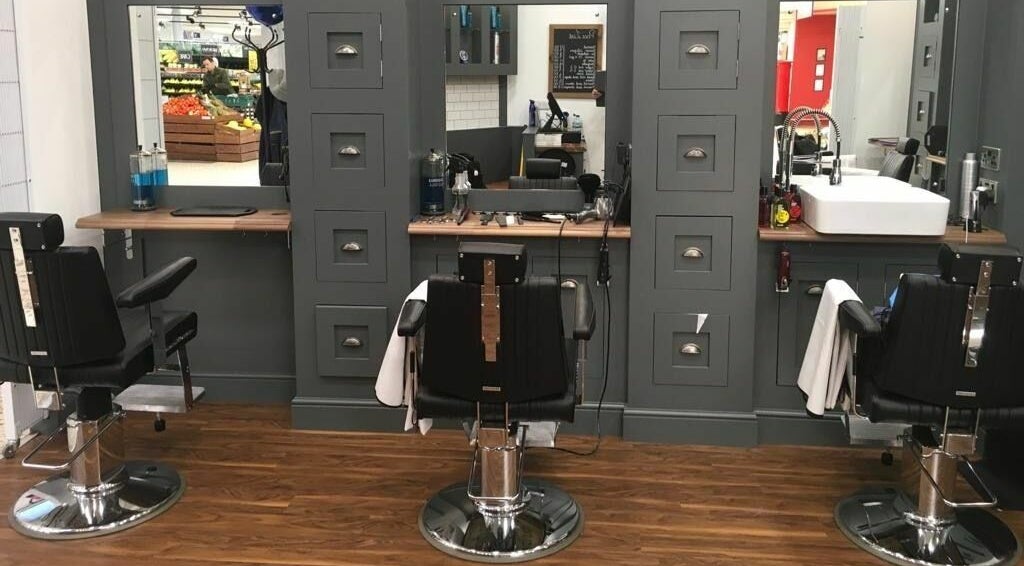 Barber chairs and stylish interior at Gould Barbers Basildon (Mayflower), Basildon, England, GB.