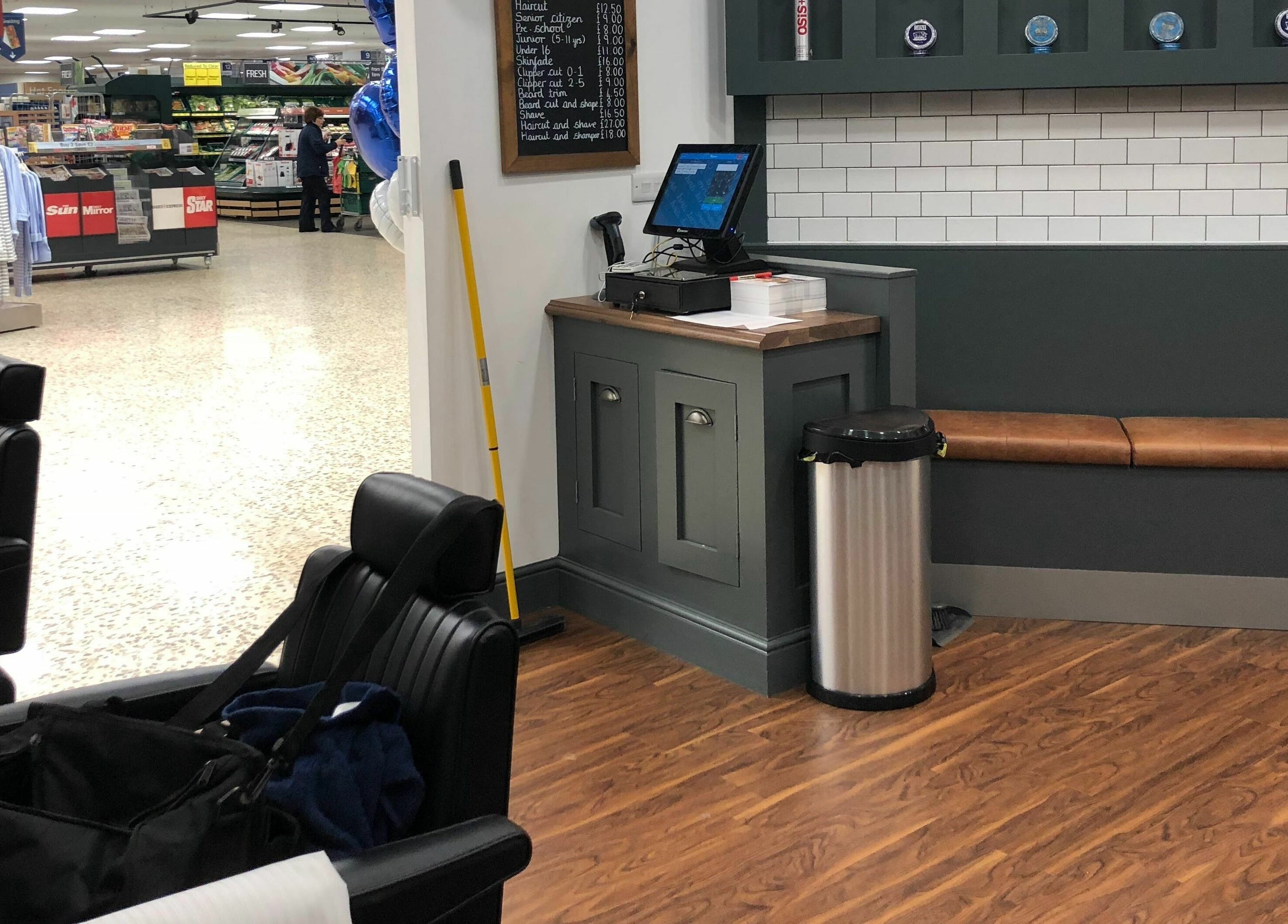 Modern barber interior at Gould Barbers Basildon (Mayflower) in Basildon, England, GB, showcasing sleek chairs.