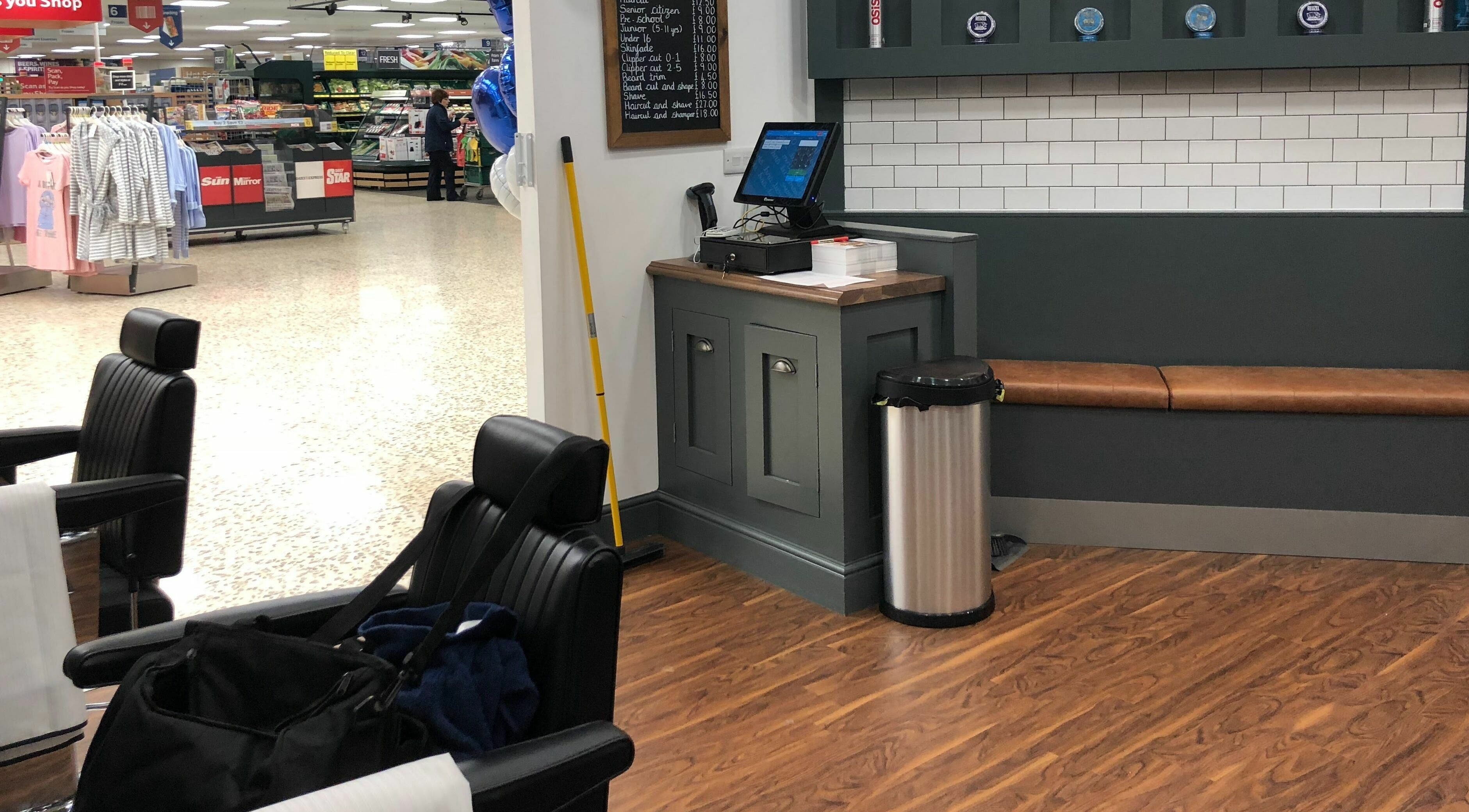 Modern barber interior at Gould Barbers Basildon (Mayflower) in Basildon, England, GB, showcasing sleek chairs.