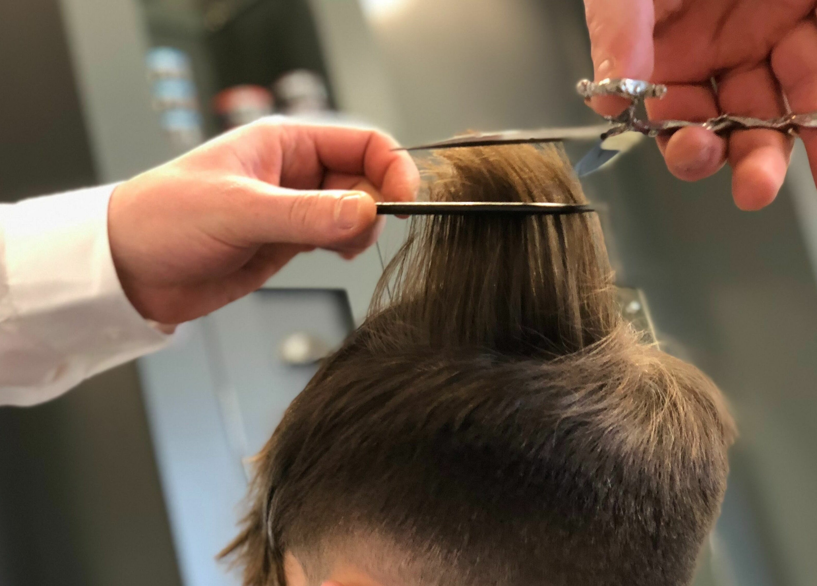 Professional haircutting at Gould Barbers Basildon (Mayflower), Basildon, England, GB, showing expert technique.