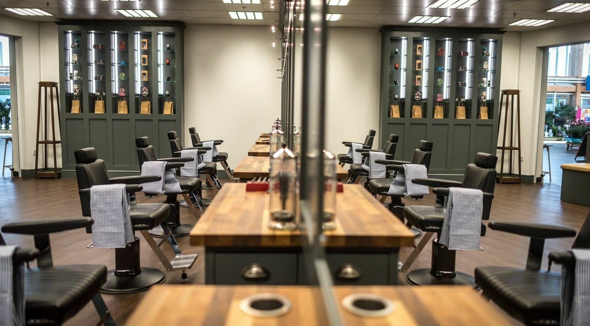 Modern interior of Gould Barbers Leicester featuring sleek styling stations. Located in Leicester, England, GB.