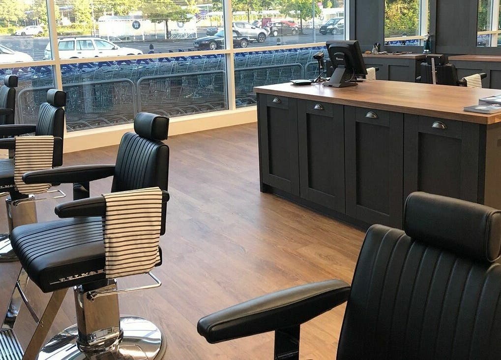 Chic interior of Gould Barbers Warwick with modern chairs at Warwick, England, GB.