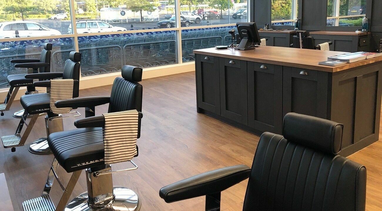 Chic interior of Gould Barbers Warwick with modern chairs at Warwick, England, GB.