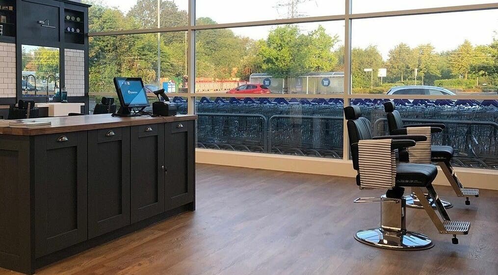 Interior of Gould Barbers Warwick in Warwick, England, GB with modern chairs and spacious design.