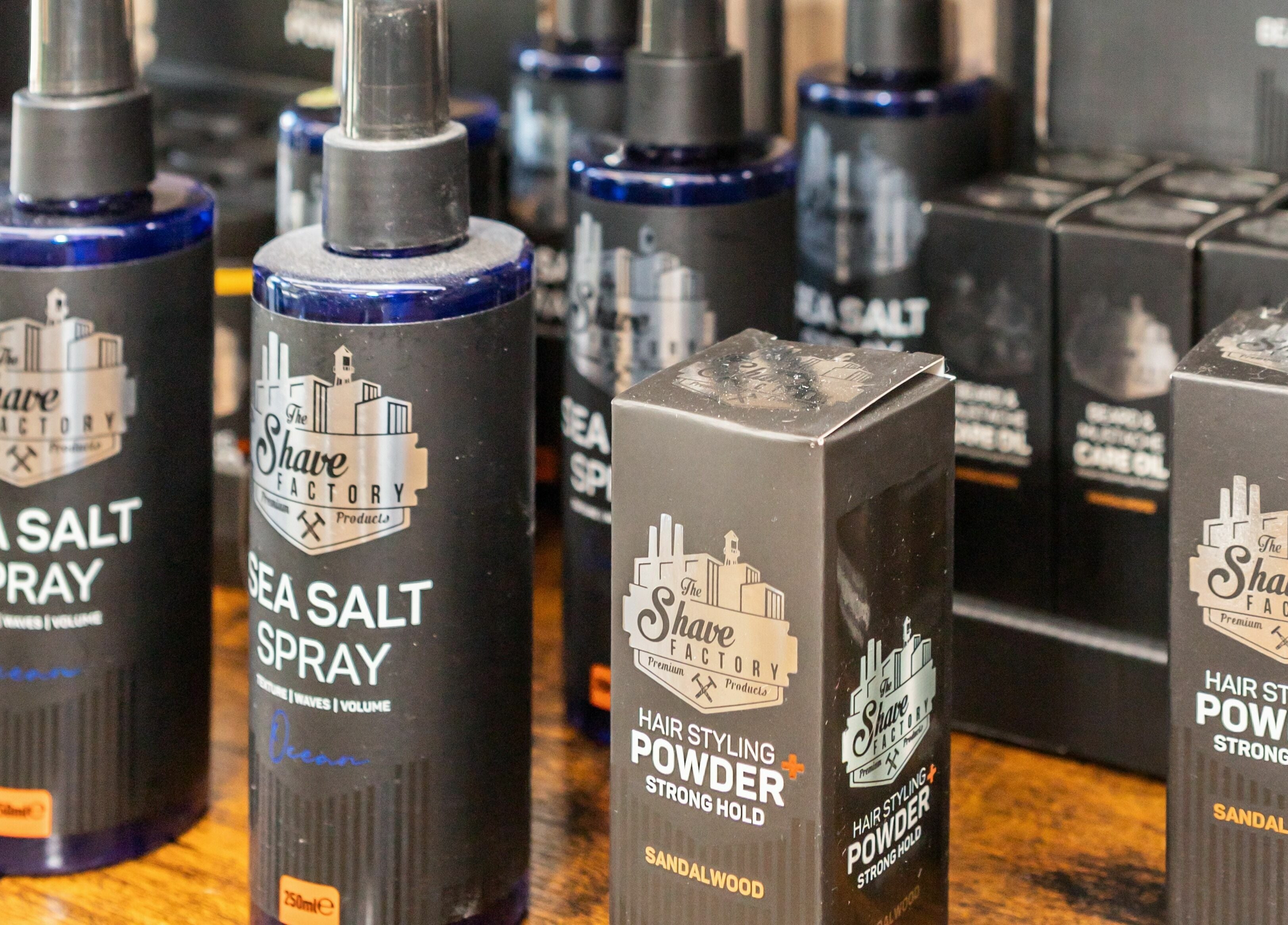 High-end hair products at Gould Barbers Lakeside, Lakeside, England, GB. Sea Salt Spray and Styling Powder displayed.