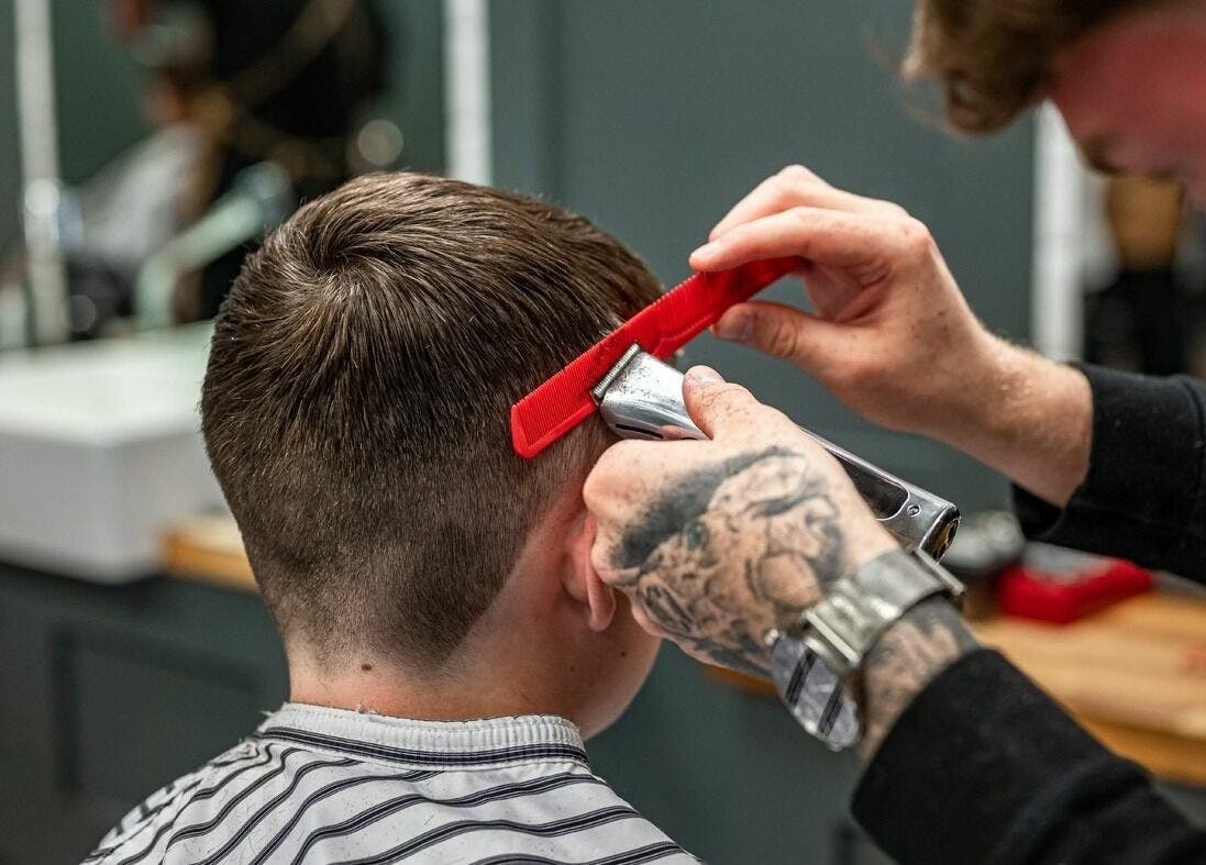 Professional haircut at Gould Barbers Sheffield, Sheffield, England, GB. Expert styling in modern barber setting.