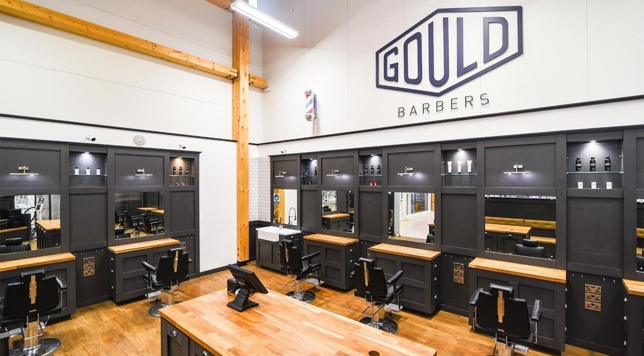 Interior of Gould Barbers York showcasing sleek black stations and modern design in York, England, GB.