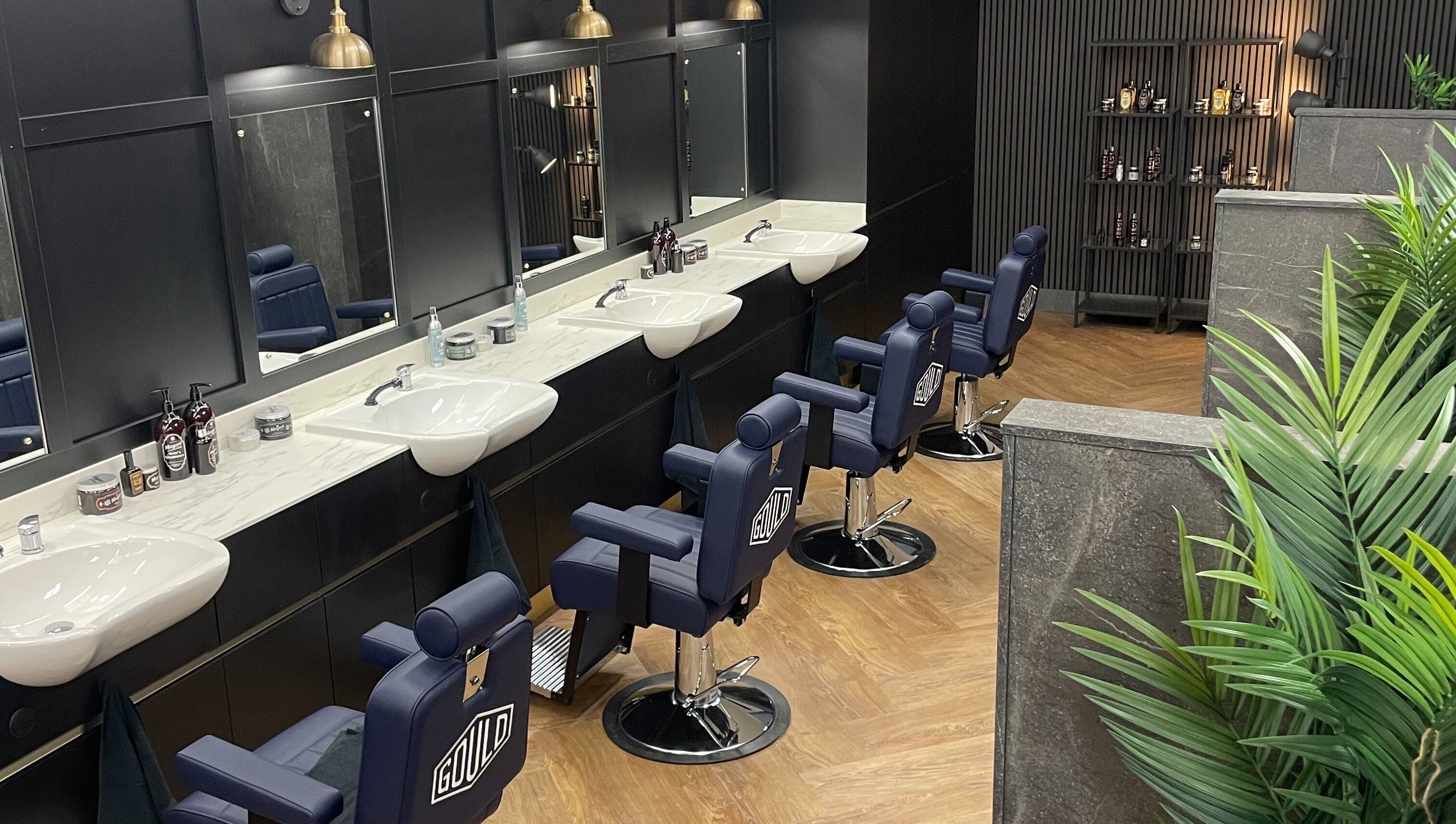 Stylish barber chairs at Gould Barbers Southampton, located in Bursledon, England, GB, showcasing sleek design.