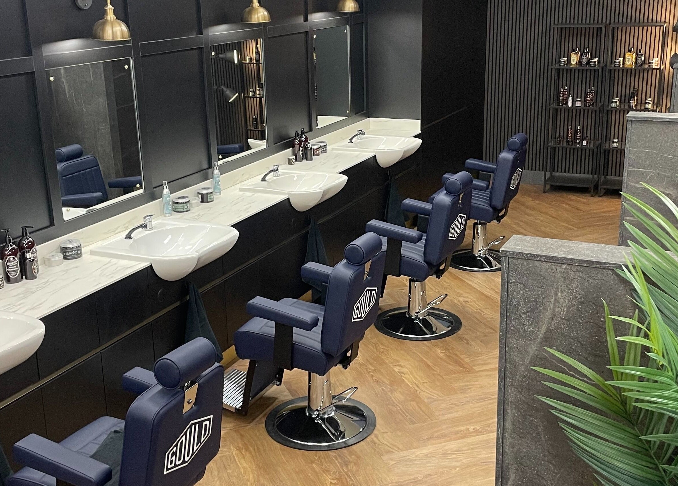 Stylish barber chairs at Gould Barbers Southampton, located in Bursledon, England, GB, showcasing sleek design.