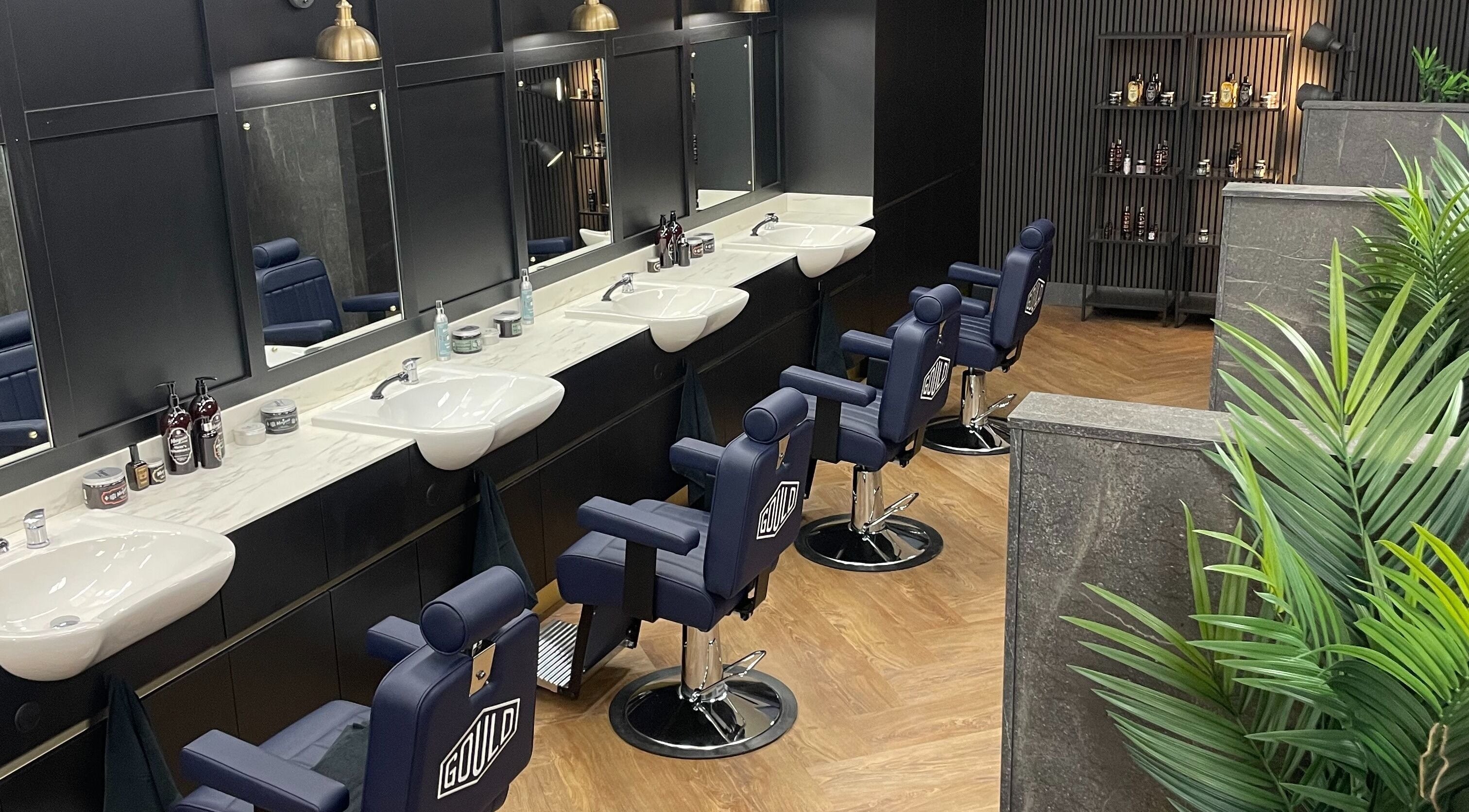 Stylish barber chairs at Gould Barbers Southampton, located in Bursledon, England, GB, showcasing sleek design.