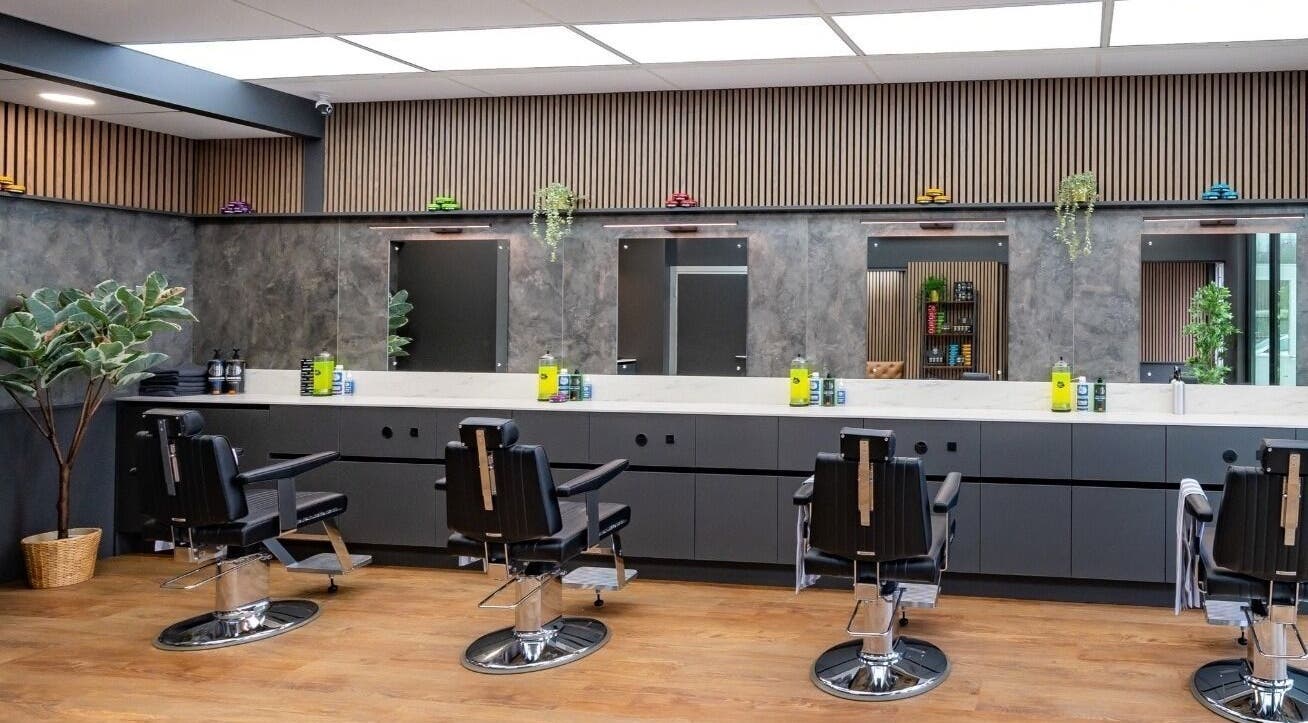 Modern interior of Gould Barbers St Neots, featuring sleek chairs and decor in St Neots, England, GB.