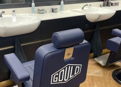 Modern barber chair at Gould Barbers Lowestoft in Lowestoft, England, GB, showcasing sleek design and comfort.