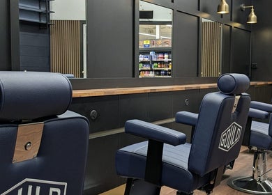 Stylish barber chairs at Gould Barbers Lowestoft located in Lowestoft, England, GB, offering quality grooming services.