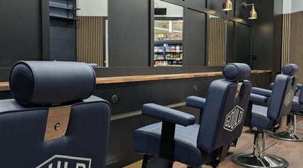 Stylish barber chairs at Gould Barbers Lowestoft located in Lowestoft, England, GB, offering quality grooming services.