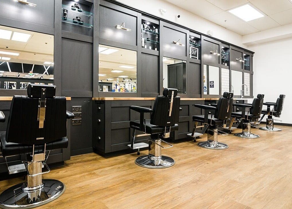 Interior of Gould Barbers Poole featuring sleek barber chairs in Poole, England, GB.