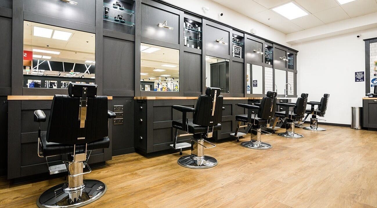 Interior of Gould Barbers Poole featuring sleek barber chairs in Poole, England, GB.