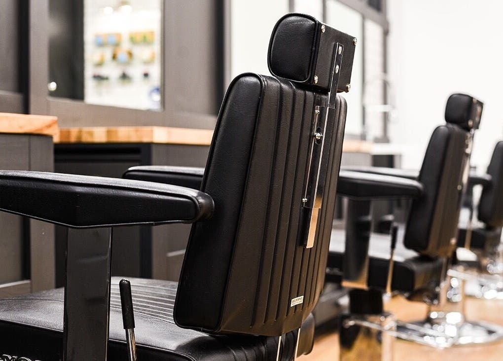 Barber chairs at Gould Barbers Poole, Poole, England, GB, showcasing modern elegance and comfort.